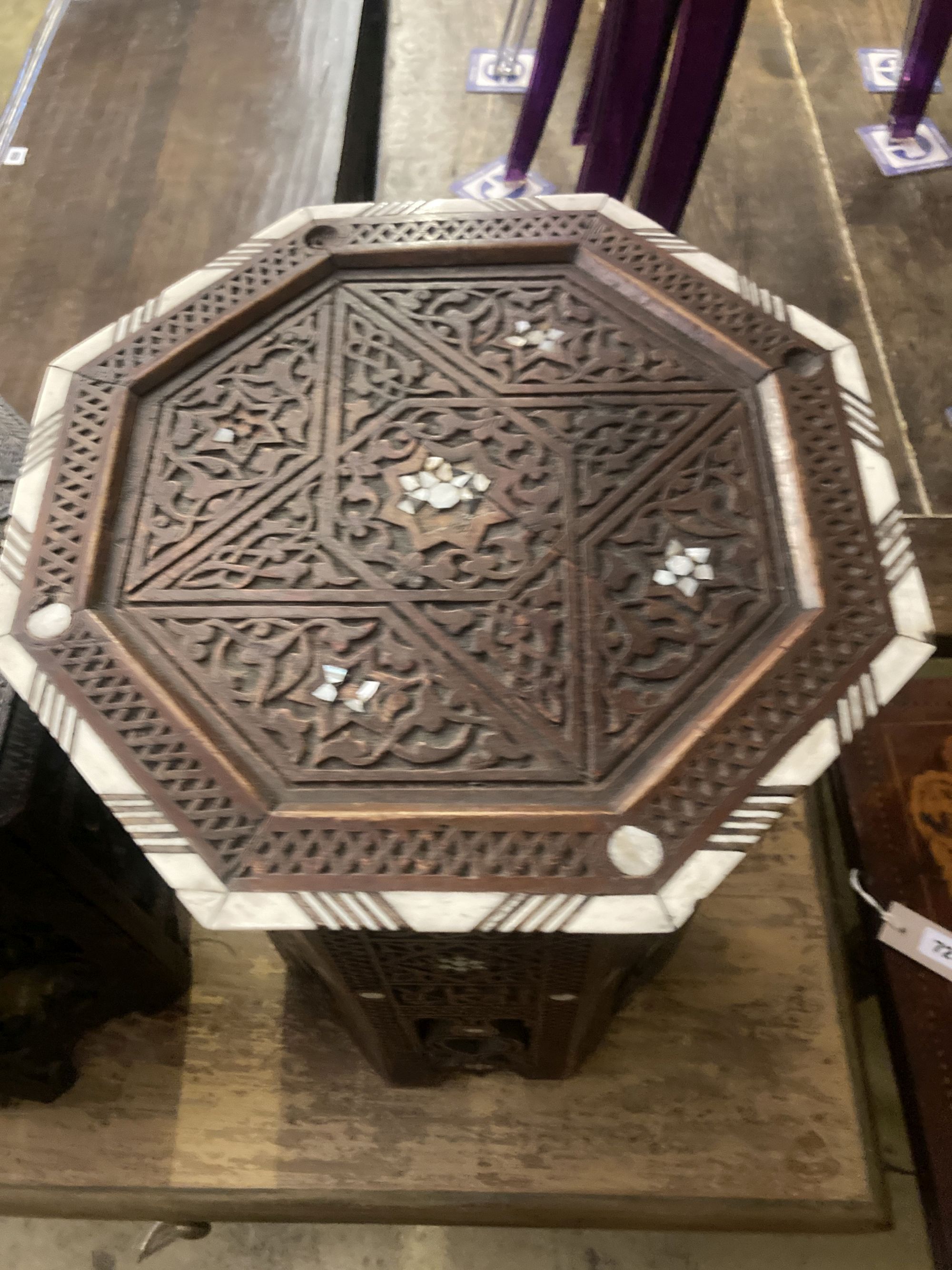 Two Moorish octagonal carved occasional tables, larger width 38cm, height 42cm